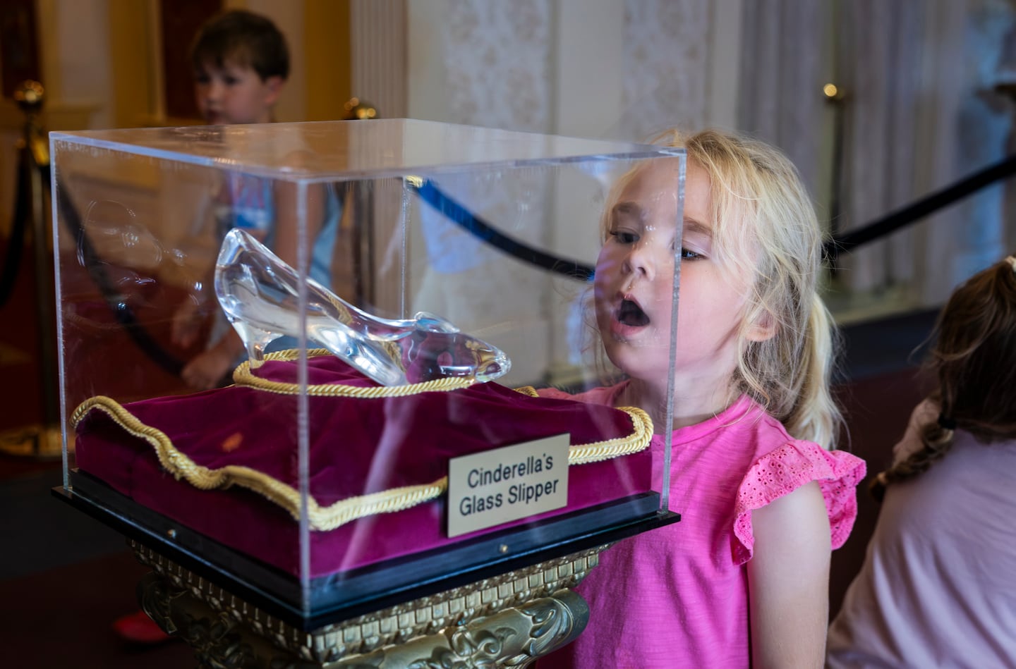 A young visitor peered at Cinderella’s glass slipper.