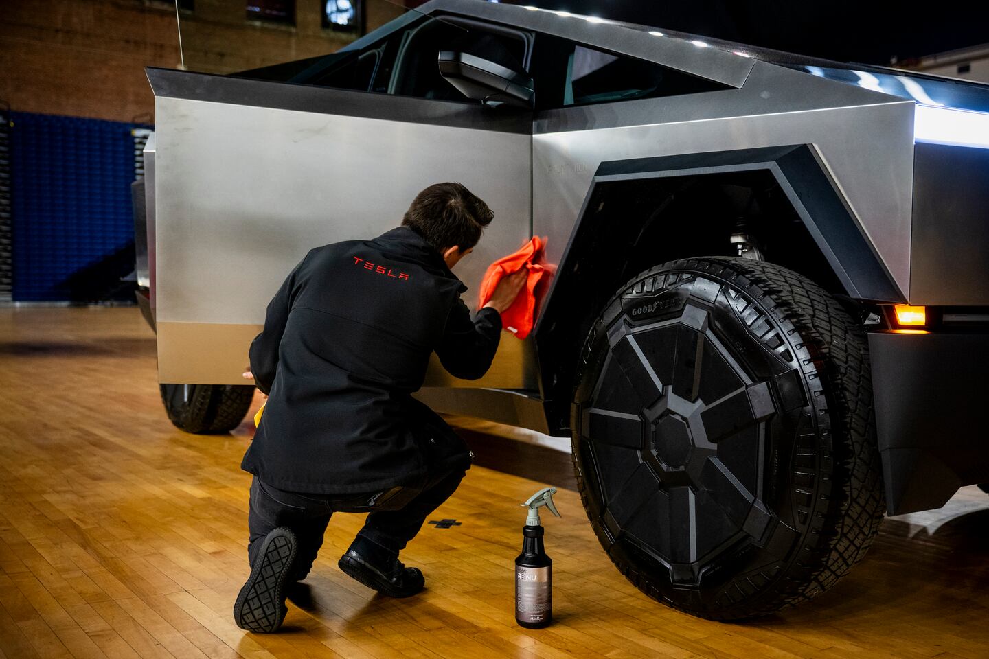 Chris Callahan, a Tesla Advisor, polishes a Tesla Cybertruck model during an Environmental Protection Agency event in Washington, on March 20.