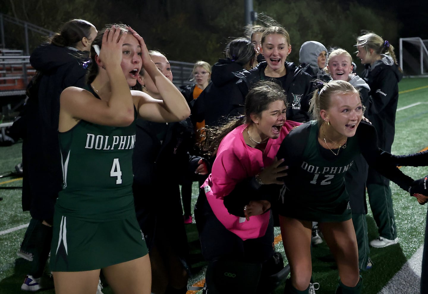 Moments after scoring the winner, Alaina Manuel (left) and her teammates celebrated their semifinal win at Bridgewater-Raynham High School.