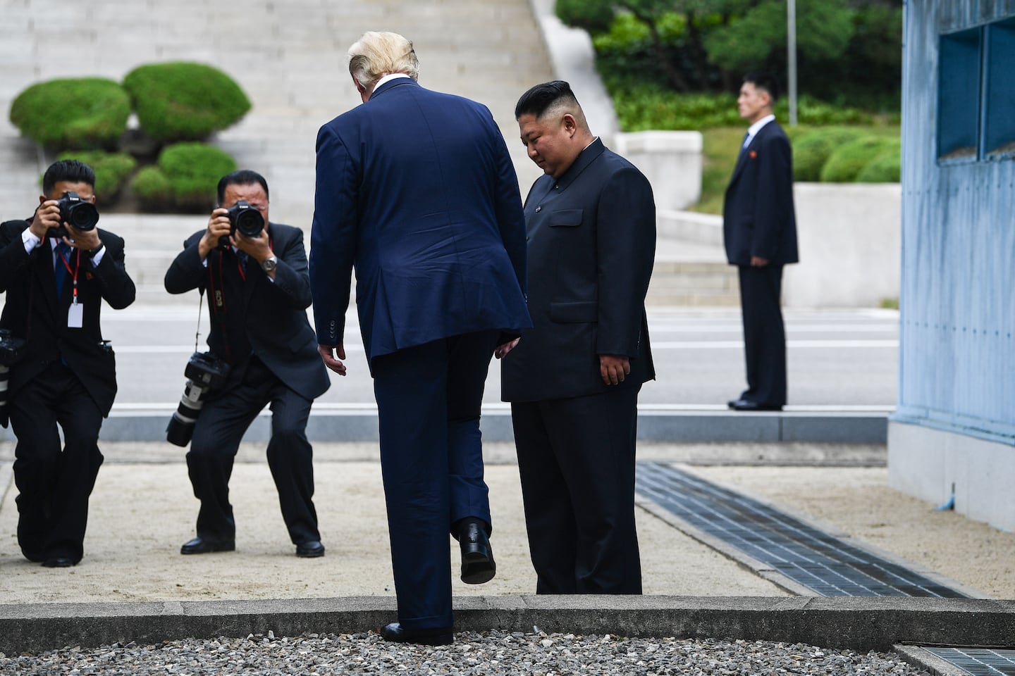 President Trump steps into North Korea at the Korean Peninsula’s demilitarized zone just before shaking hands with Kim Jong Un, the North Korean leader.