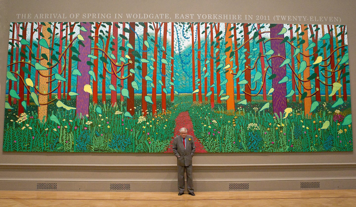 British artist David Hockney stands before one of his paintings of the East Yorkshire landscape at The Royal Academy of Arts in Piccadilly, London.