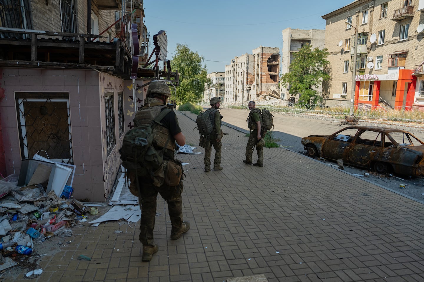 On Monday, Aug. 10, 2026, Ukrainian soldiers walk along the street in the frontline town of Druzhkivka, Donetsk region, Ukraine.